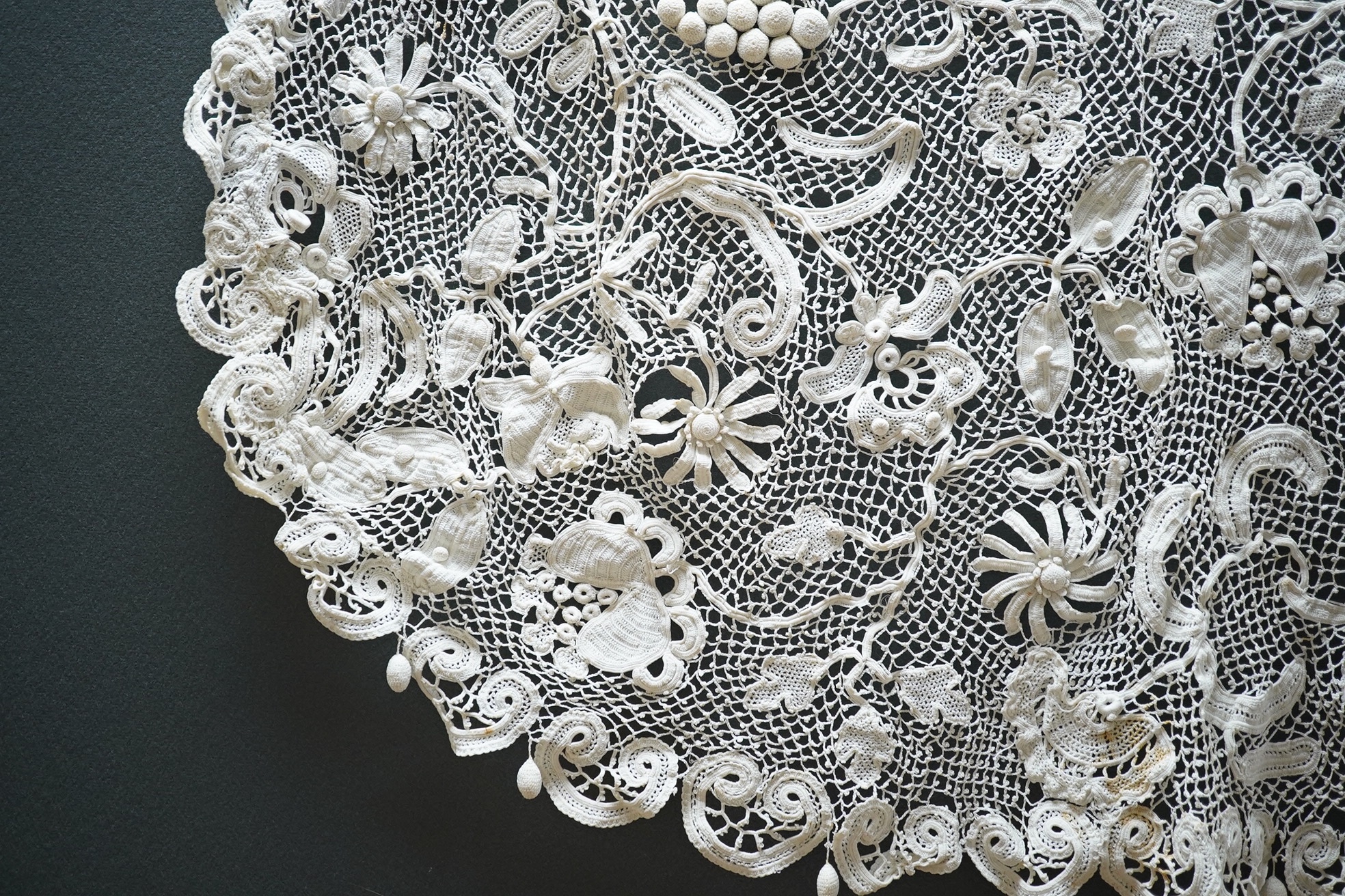 A fancy crochet and anglaise hand worked tablecloth, together with a collection of lawn and linen table linen, mats, etc. and various lengths of lace including a panel of Irish crochet, Irish crochet panel 142cm long x 5